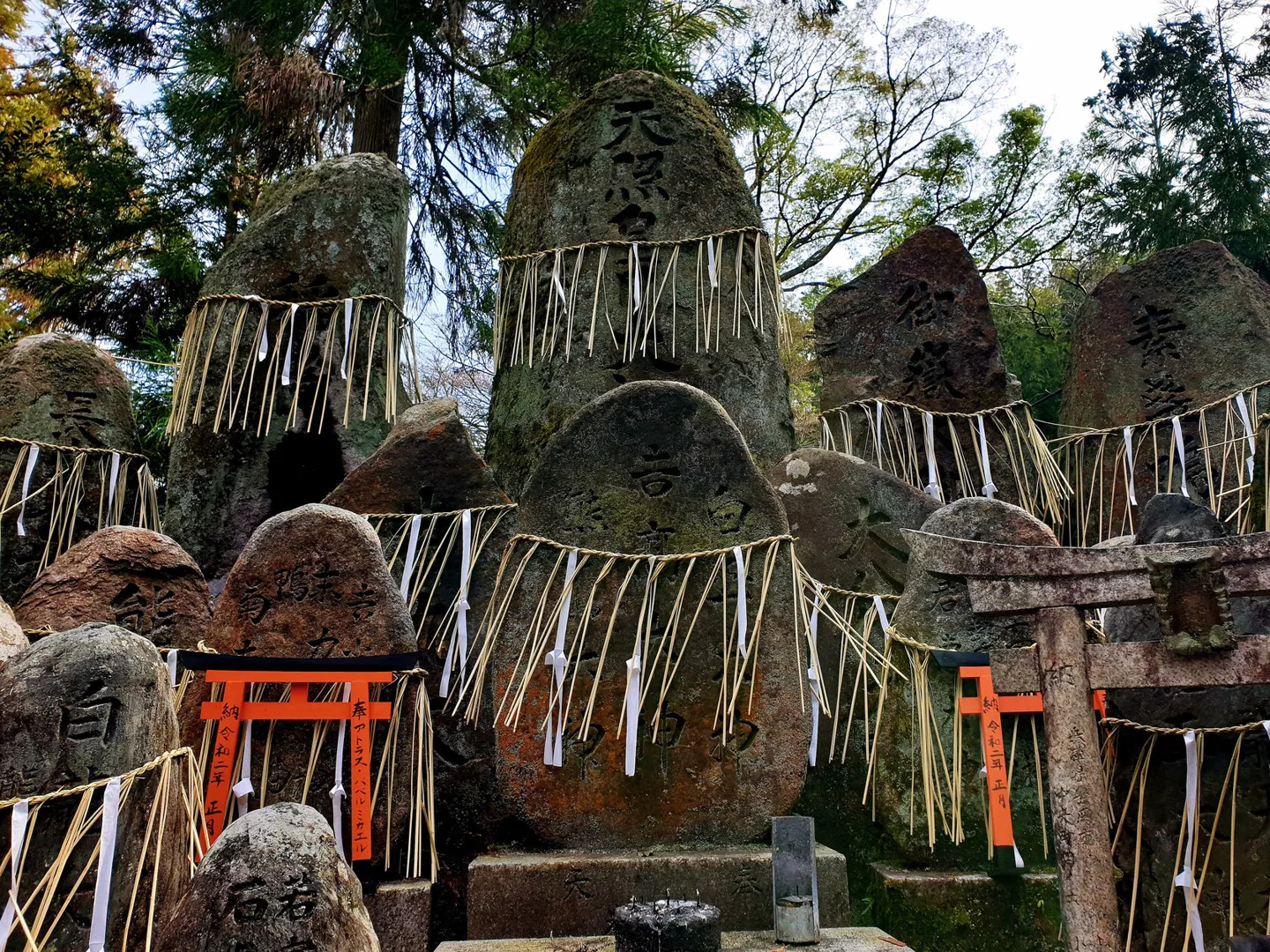 Stone altars and miniature torii on Mount Inari